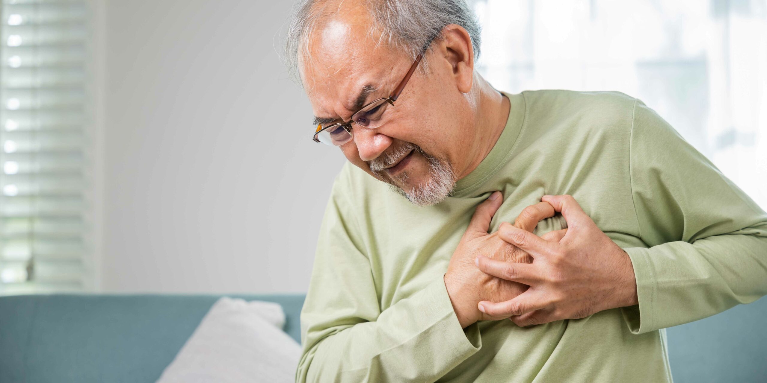 Asian older man have congenital disease suffering from heartache